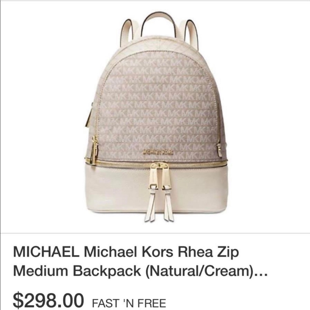 MK Rhea zip back pack white 
New with tags